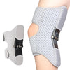 Gray joint support knee pad for pain relief worn on the knee area.