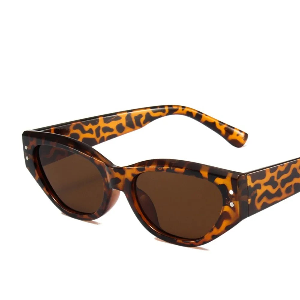 Brown leopard print sunglasses with a cat eye shape and rhinestone details