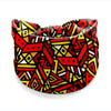 A colorful patterned stretch cotton headband featuring geometric shapes in red, yellow, and black.