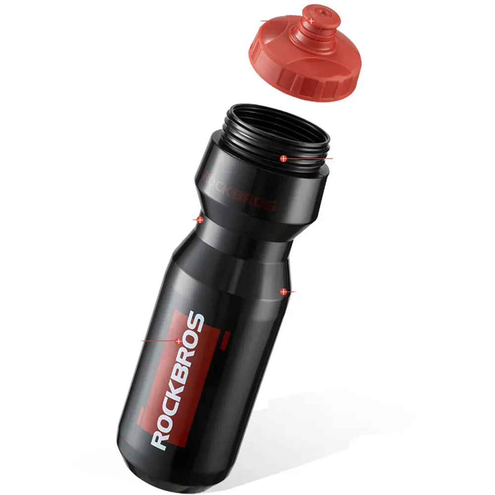 A black sports water bottle with a red cap and silicone seal, shown from the side.