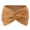 A beige twisted criss cross elastic headband for yoga and sports.