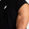 A man wearing a black sleeveless fitness tank top with a white lightning bolt logo on the chest.