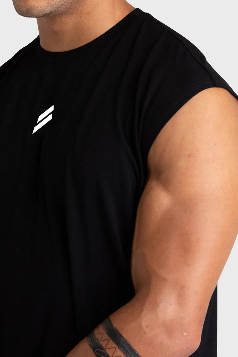 A man wearing a black sleeveless fitness tank top with a white lightning bolt logo on the chest.