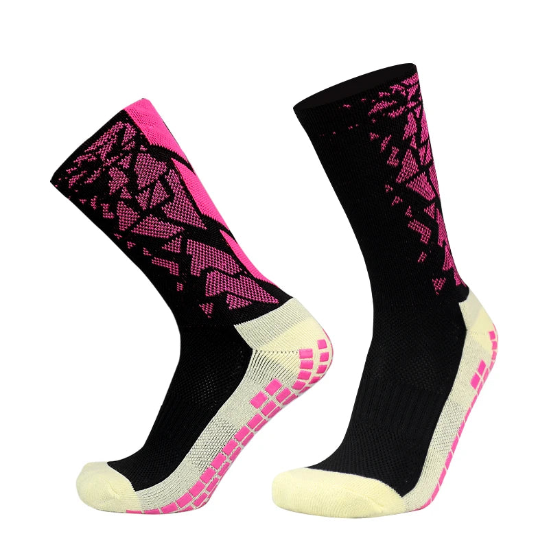 A pair of black and pink anti-slip silicone football socks shown from the side.