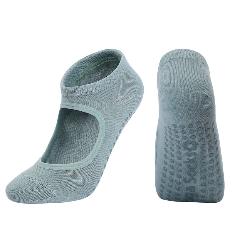 A pair of light gray breathable women's Pilates and yoga socks shown from the side.
