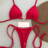 A bright red halter bikini set displayed against a light gray background.