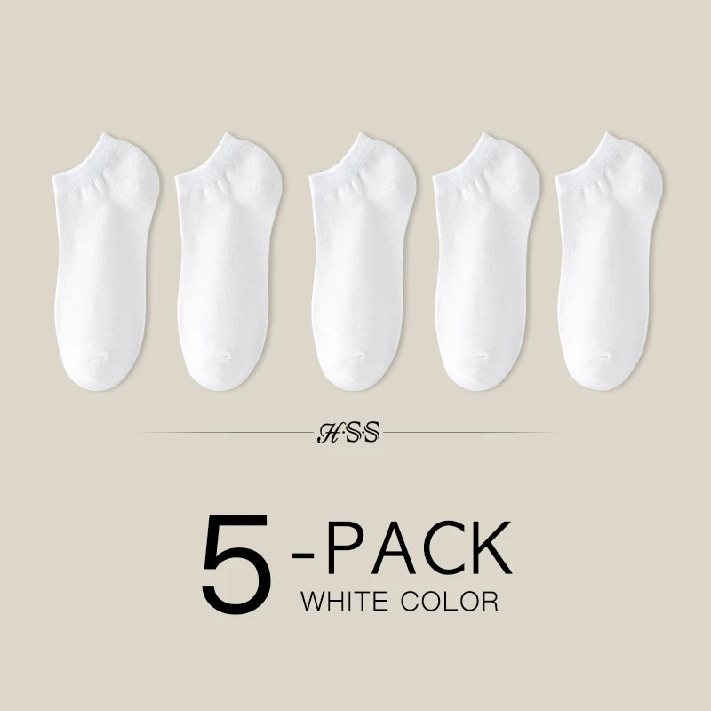 A pack of five white women's thin cotton no-show socks.