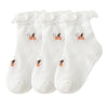 A pack of three white thin summer casual baby socks for kids