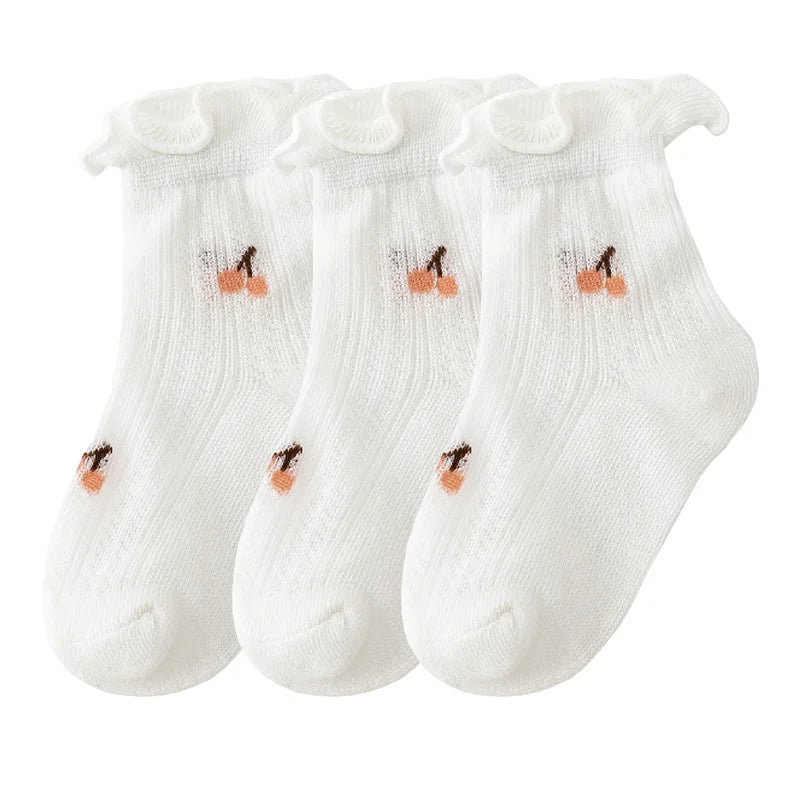 A pack of three white thin summer casual baby socks for kids