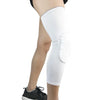 White compression knee pads worn on a person's leg.