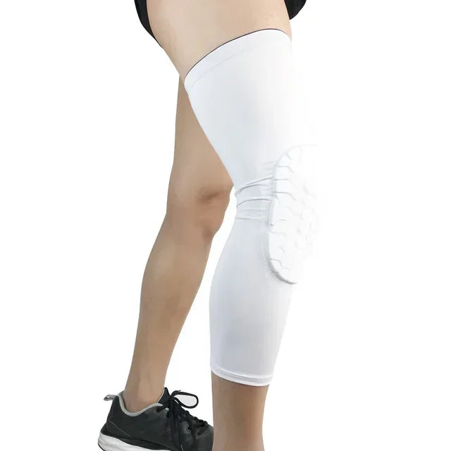 White compression knee pads worn on a person's leg.