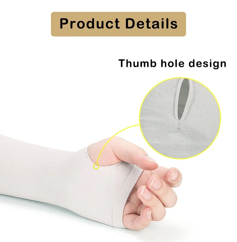 A hand is holding a light gray UV protection arm sleeve with a thumb hole design.