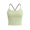 A light sage green supportive women's sports bra with thin gray straps.