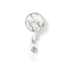 A round, white and gray marble-patterned ID badge is attached to a clear keychain.