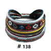 A close-up of a multicolored, patterned boho polka dot knotted headband.