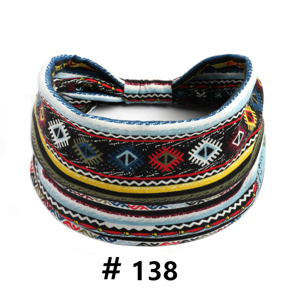 A close-up of a multicolored, patterned boho polka dot knotted headband.