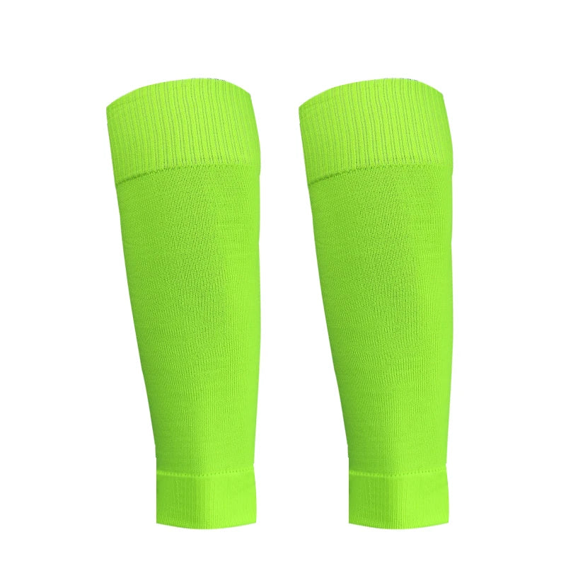 A pair of neon lime green honeycomb grip football socks displayed vertically.