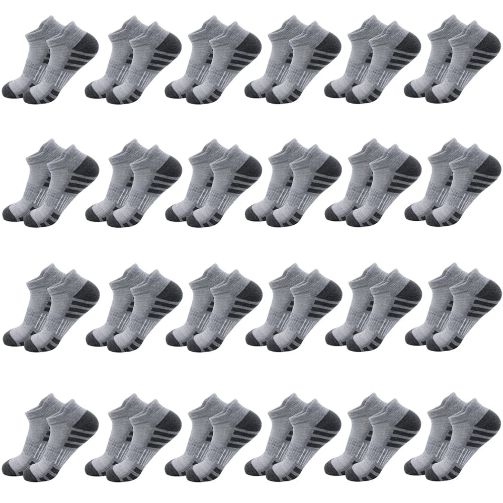 A pack of gray athletic running socks for men and women shown from the side.