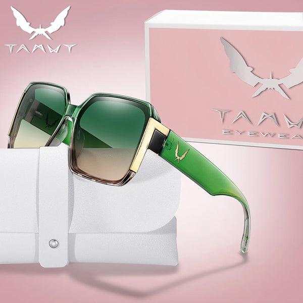 A pair of green and gold trendy square sunglasses resting on a white surface.