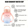 A pink bear gradient water cup with a strap, made from food-grade silicone and plastic materials.