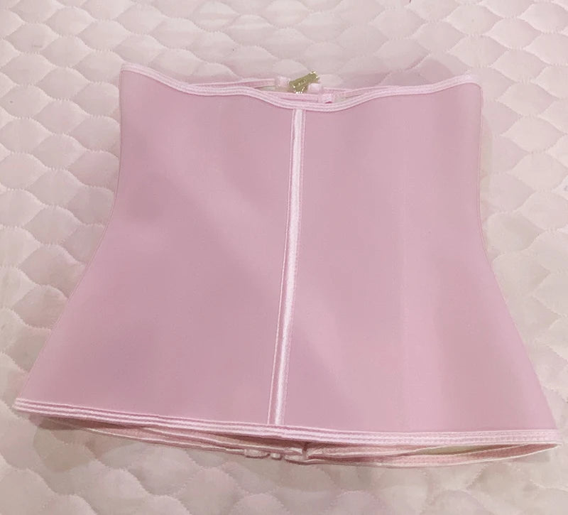 A light pink double compression waist trainer corset body shaper displayed flat.