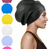 A woman wearing a black silicone swim cap, with various colored caps displayed beside it.