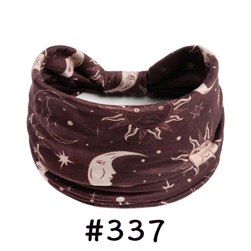 Dark brown boho knotted cotton headband featuring crescent moon and star designs