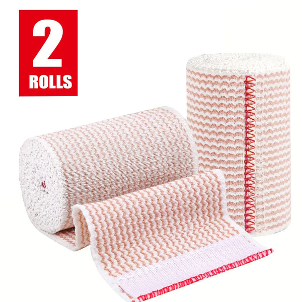 Two rolls of pink and white reusable hook and loop elastic compression wraps.