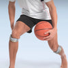 A person wearing a white shirt and black shorts demonstrates the sports patella strap on their knee for tendon support.