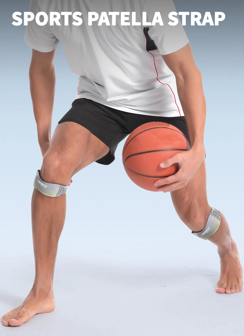 A person wearing a white shirt and black shorts demonstrates the sports patella strap on their knee for tendon support.