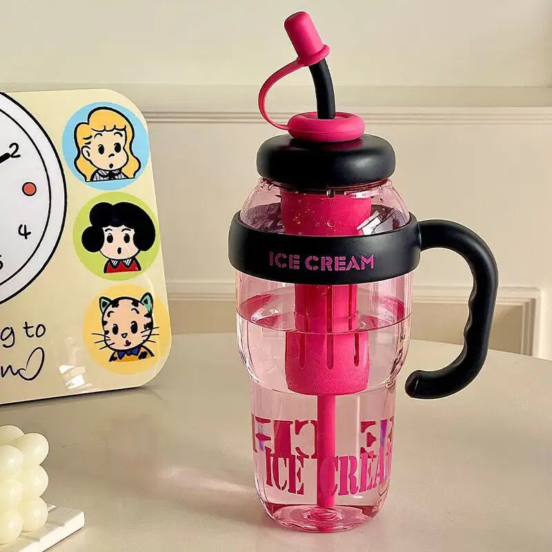 A pink reusable leak-proof water bottle with a black handle and a pink straw, sitting on a light surface.