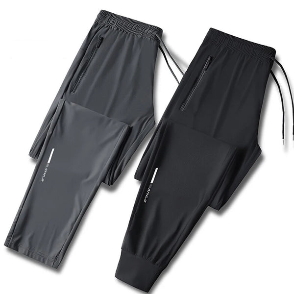 Black men's ice silk performance pants shown flat lay with a folded version