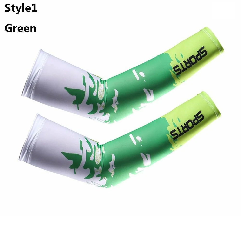 A pair of green sports arm sleeves with white tree designs shown against a white background.