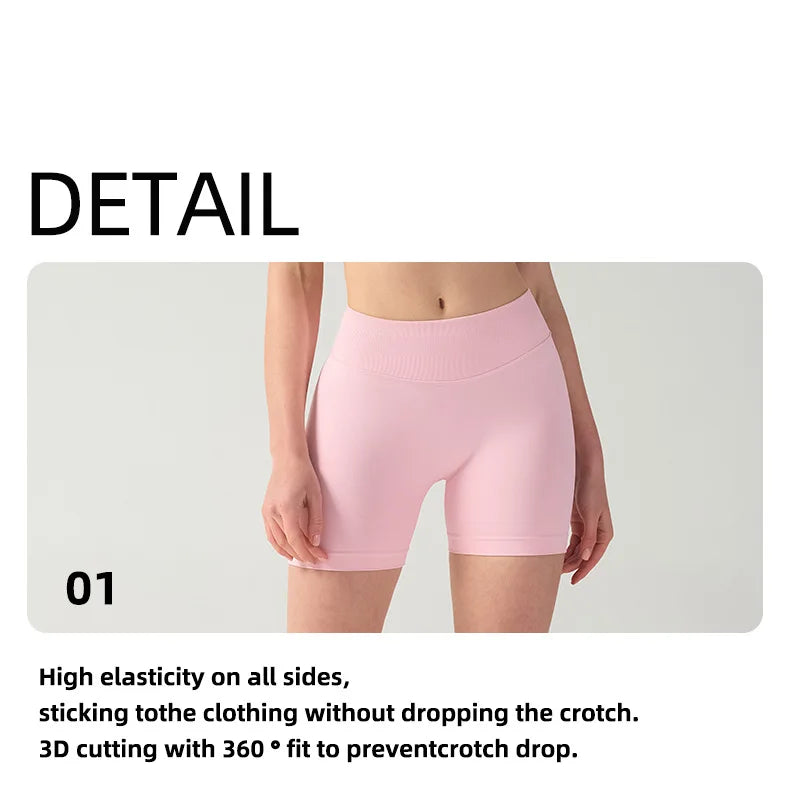 Pink high-waisted knit fitness shorts shown on a model, highlighting the stitching and fit.