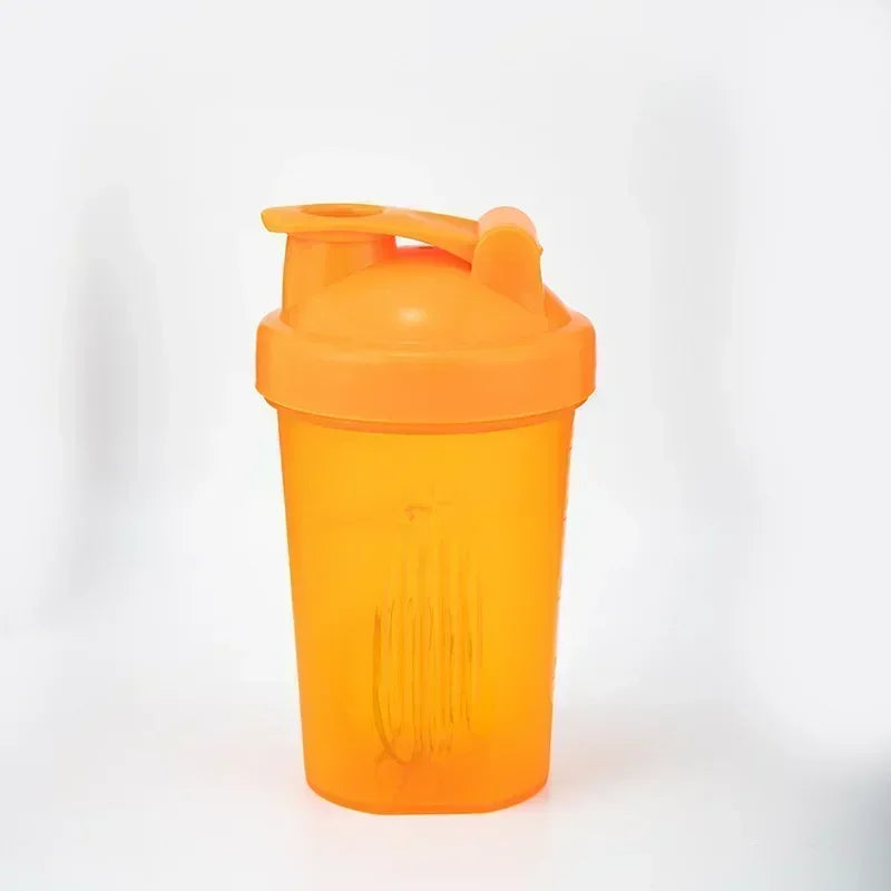 An orange leakproof protein shaker bottle standing upright against a white background.