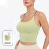 A model wearing a light green summer strappy yoga sports bra with built-in padding.