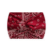 A deep red boho printed wide knotted headband with intricate white patterns.