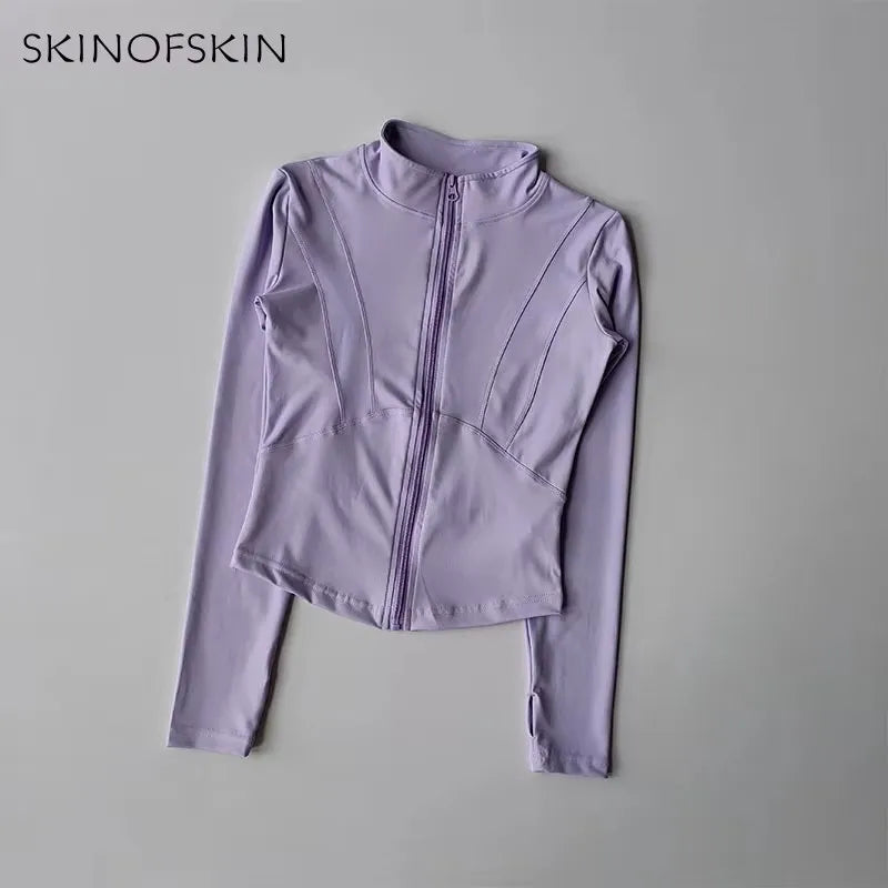 A light purple quick-dry yoga and fitness jacket with a full zip collar shown against a plain gray background.