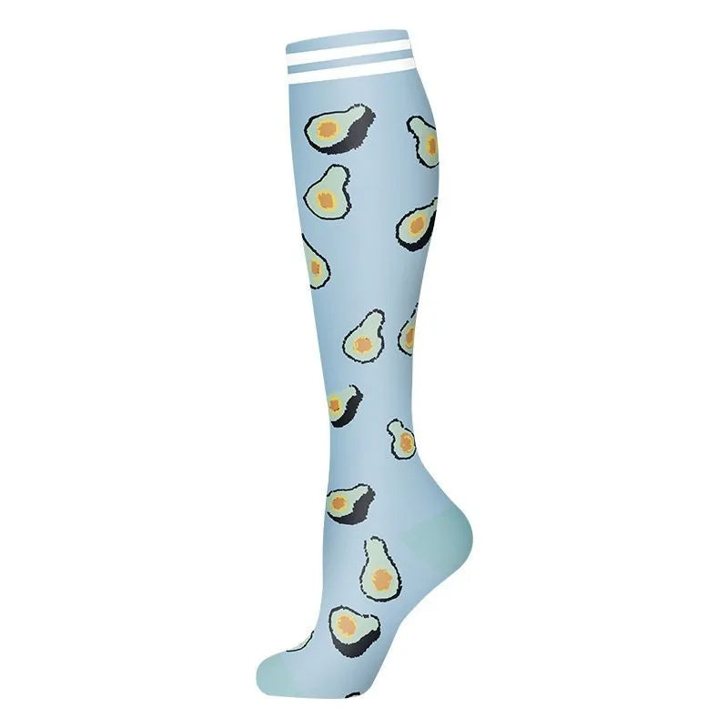 Light blue compression socks featuring a pattern of sliced avocado shapes.