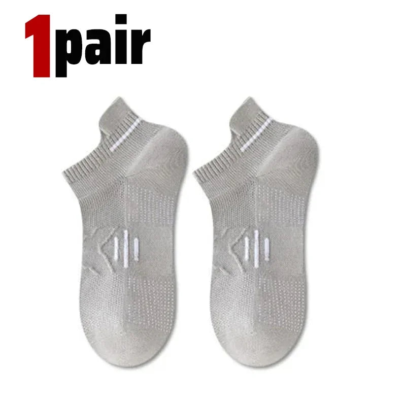 A pair of light gray breathable men's running socks shown from the top view.
