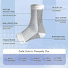 White ankle compression socks with a mesh design showing features like arch support and heel cushioning.