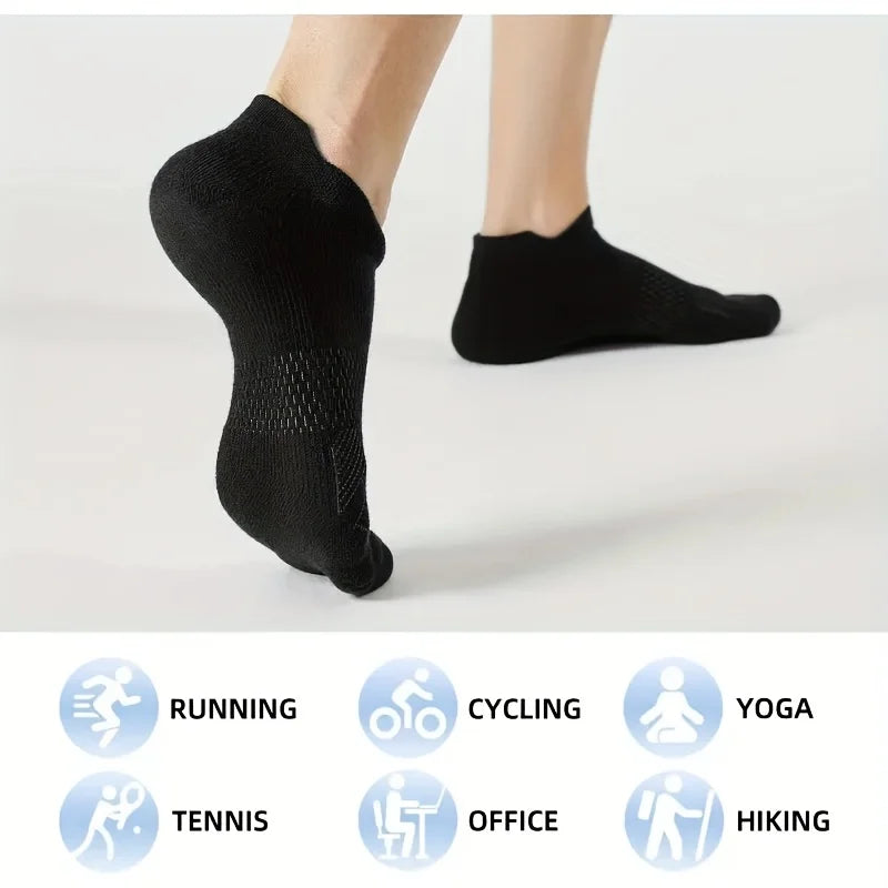 Black performance compression ankle socks displayed on a foot, with icons indicating various activities like running, cycling