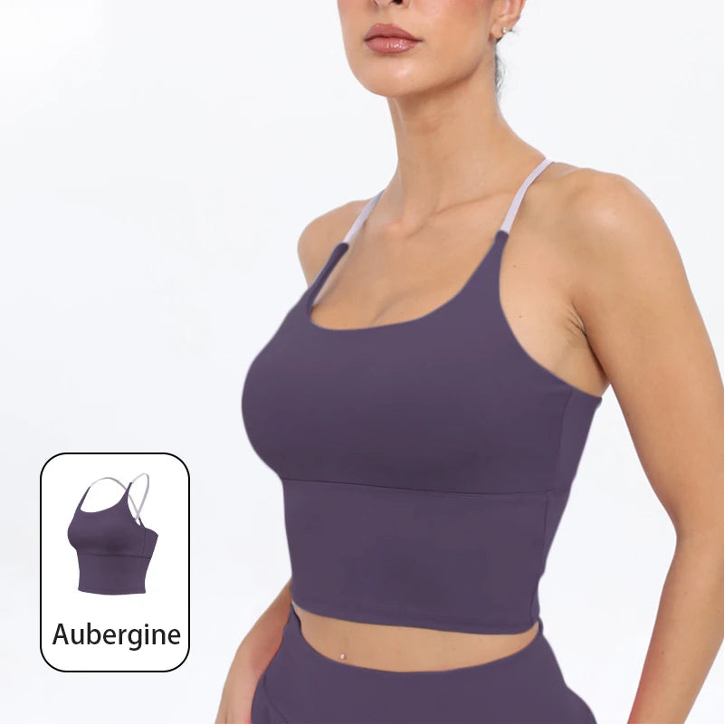 A model wearing a purple summer strappy yoga sports bra top and matching bottoms.