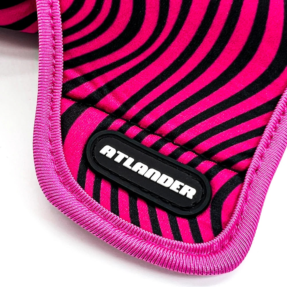 Close-up of pink and black striped goalkeeper gloves showing the brand name Atlander