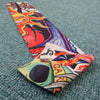 A colorful, abstract design featuring flames and vibrant colors on a long seamless tattoo sleeve.