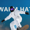 A person wearing a white winter jacket and helmet is shown in an action pose against a blue sky.