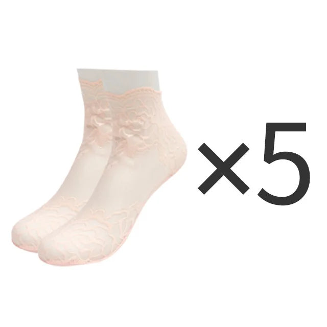 Five pairs of light pink lace mesh ankle socks displayed on a white background.