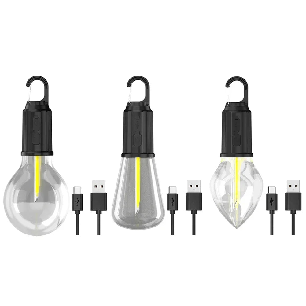 A set of five USB rechargeable LED camping lanterns with glass bulbs and charging cables.