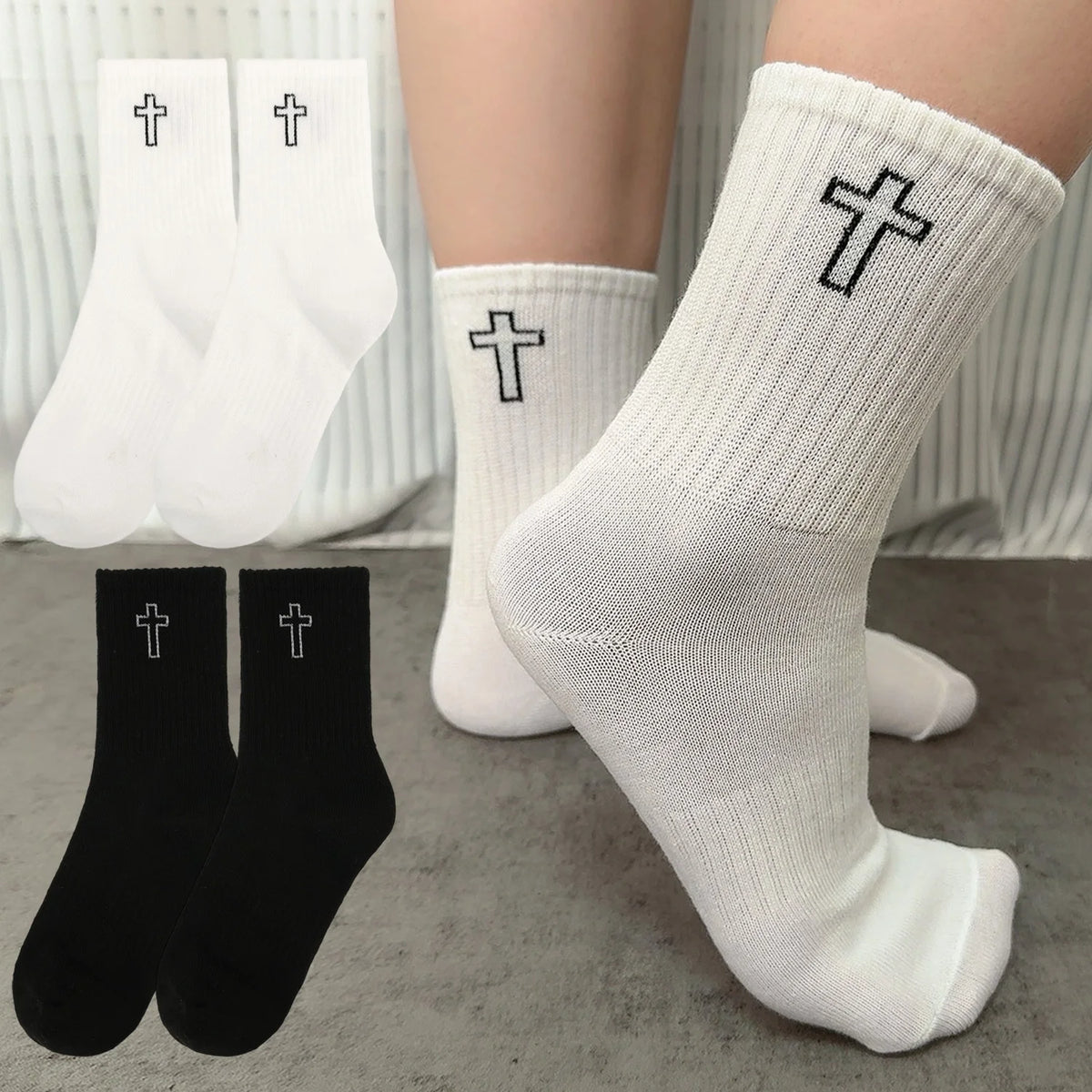 A close-up of white and black men's high-cut breathable casual crew socks featuring a cross design.