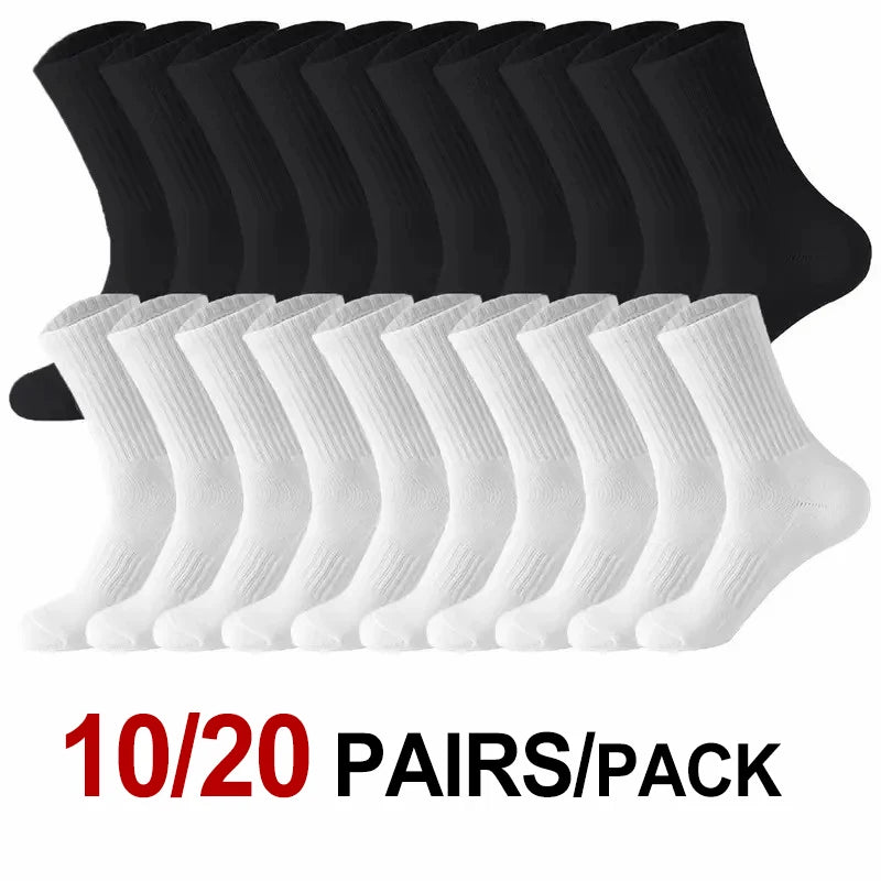 A stack of twenty pairs of black and white knee-high performance socks.